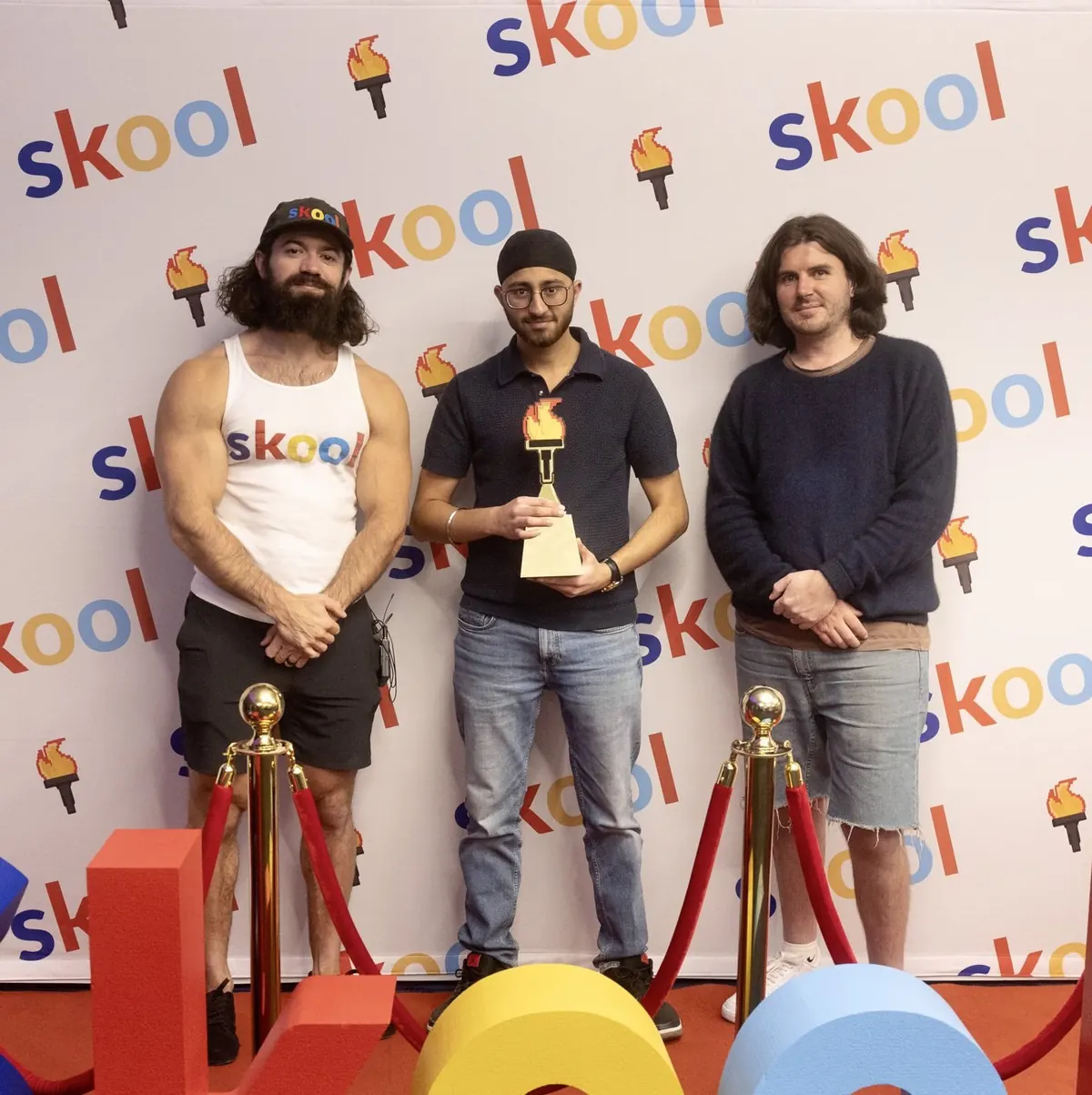 Anshjeet Singh holding the Skool Games trophy
